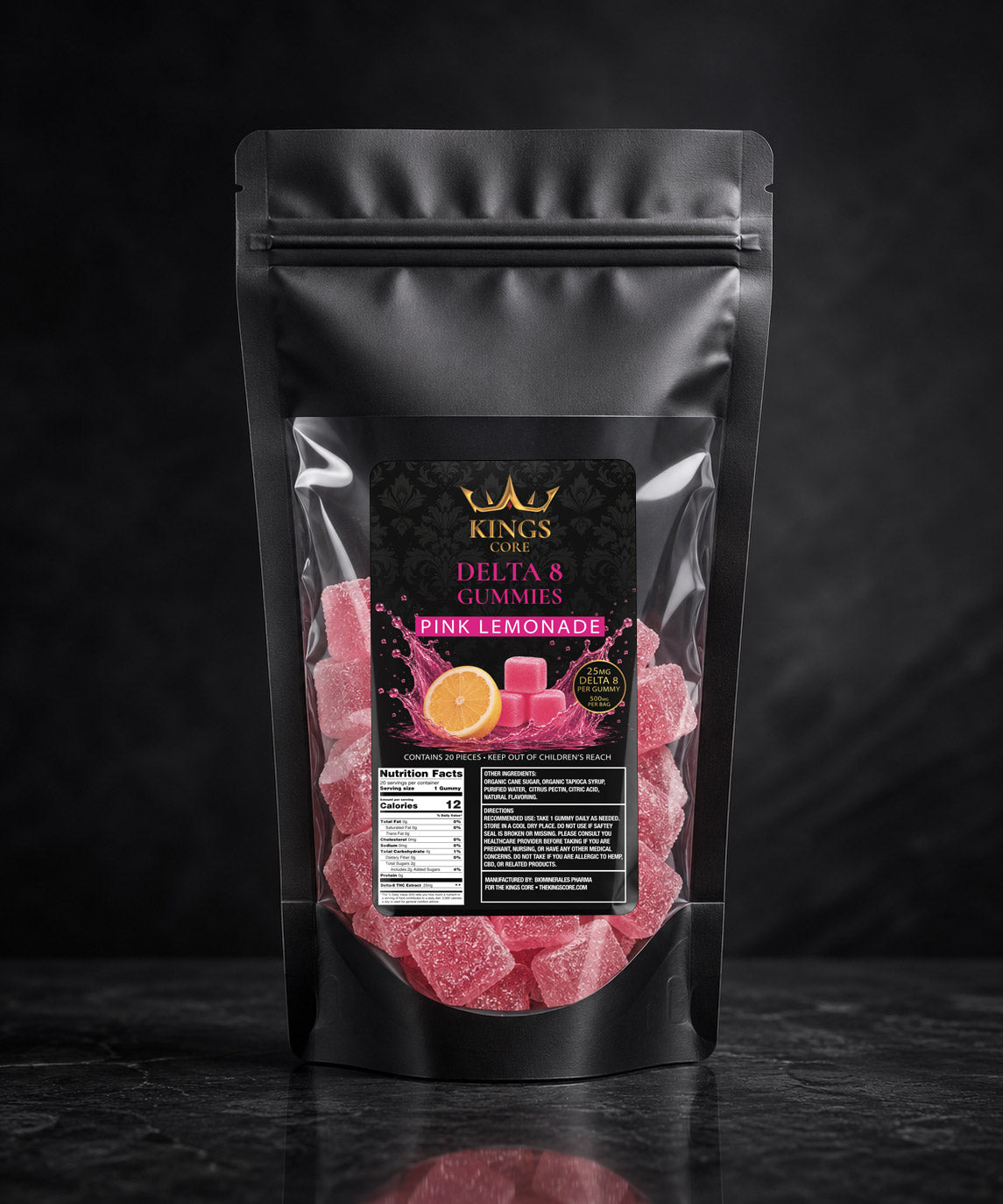 Black packaging of pink lemonade gummies with visible branding on a dark background