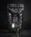 Black packaging of 'Night Reign' with green contents on a dark background